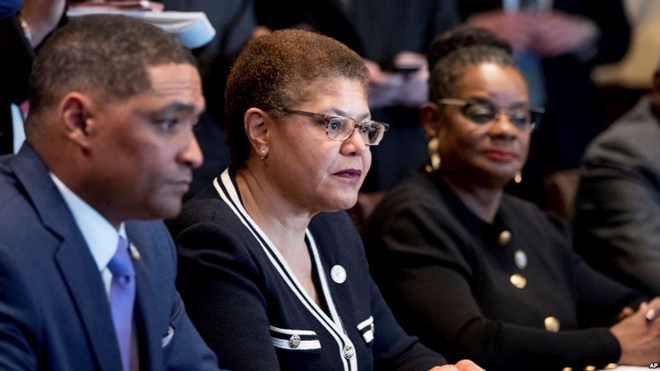 From left, Congressional Black Caucus Chairman Rep. Cedric Richmond, D-La., Rep. Karen Bass, D-Calif., Rep. Gwen Moore, D-Wis., and other members of the Congressional Black Caucus meet with President Donald Trump in the Cabinet Room of the White House, March 22, 2017.
